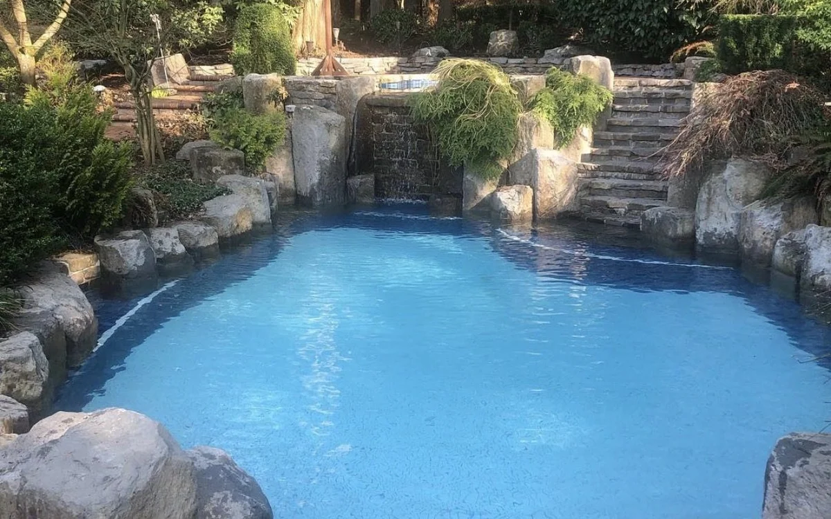Rock grotto swimming pool maintained by JK Pools and Spas