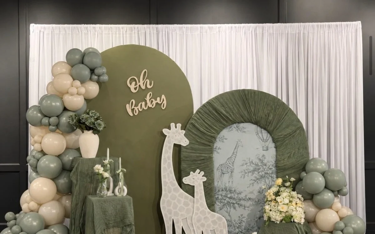 Sage green baby shower decor by The Setup Studio